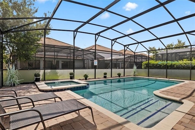 1425 Thunderbird Rd, Davenport, FL 33896 - view of pool featuring a lanai, a patio area, and a pool with connected hot tub