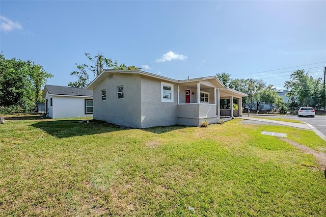 72 Campus View Dr, Orlando, FL 32810 - view of front facade featuring a front lawn and stucco siding