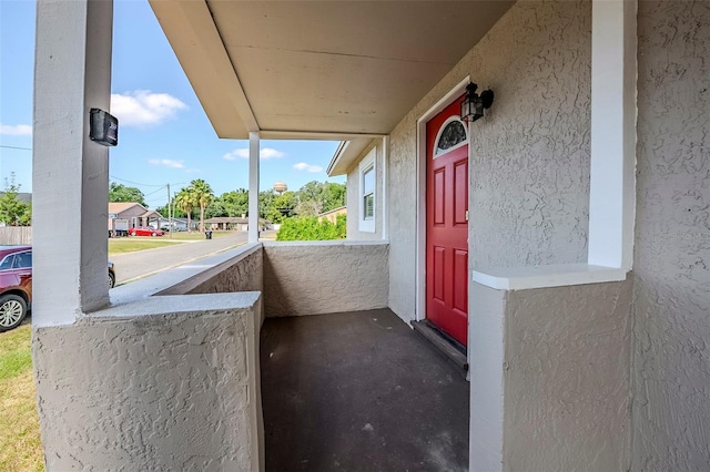 72 Campus View Dr, Orlando, FL 32810 - entrance to property with covered porch and stucco siding