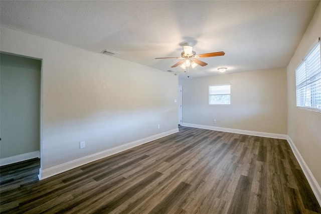 72 Campus View Dr, Orlando, FL 32810 - unfurnished room with a ceiling fan, baseboards, visible vents, and dark wood-style floors
