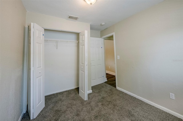 72 Campus View Dr, Orlando, FL 32810 - unfurnished bedroom featuring visible vents, carpet, baseboards, and a closet