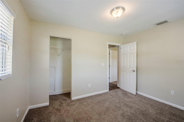 72 Campus View Dr, Orlando, FL 32810 - unfurnished bedroom with carpet flooring, baseboards, and visible vents