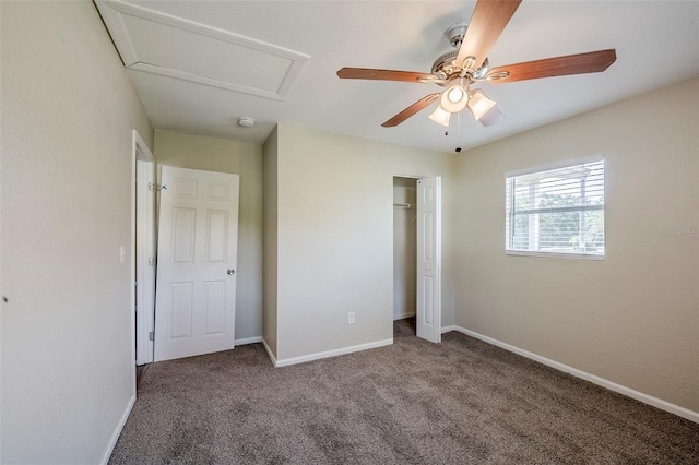 72 Campus View Dr, Orlando, FL 32810 - unfurnished bedroom featuring a closet, attic access, carpet, and baseboards