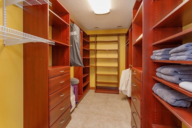walk in closet featuring light tile patterned floors