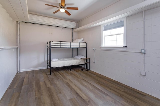 bedroom with ceiling fan and wood finished floors