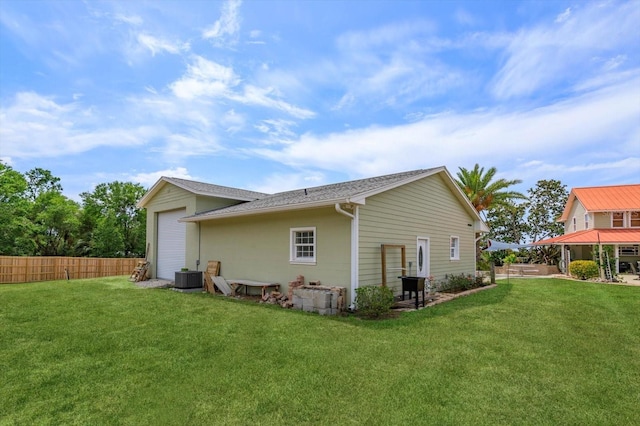 36408 E Eldorado Lake Dr, Eustis, FL 32736 - back of property with cooling unit and a garage