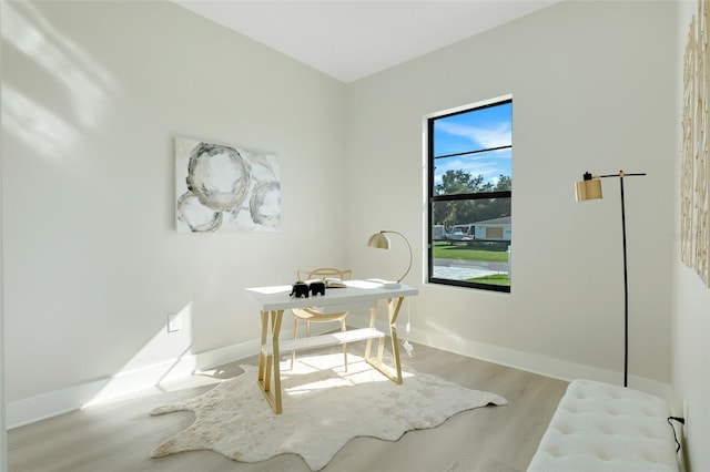 office area featuring wood finished floors and baseboards
