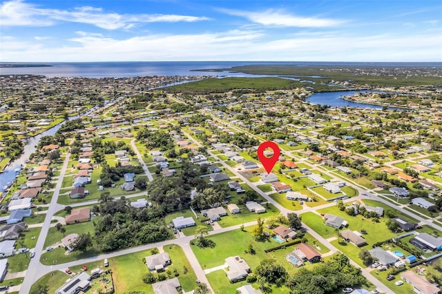 drone / aerial view featuring a water view and a residential view