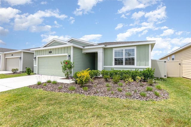 ranch-style house featuring board and batten siding, fence, a garage, a front yard, and concrete driveway