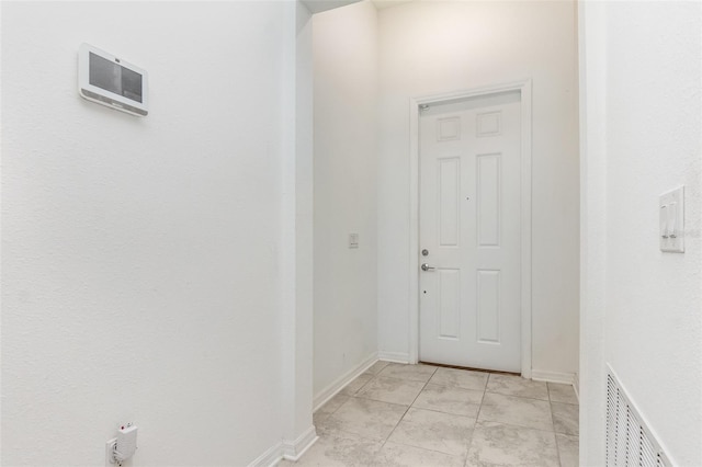 corridor with visible vents and baseboards