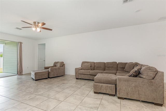 living room with visible vents, light tile patterned floors, and ceiling fan