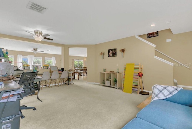 interior space with visible vents, ceiling fan, and baseboards