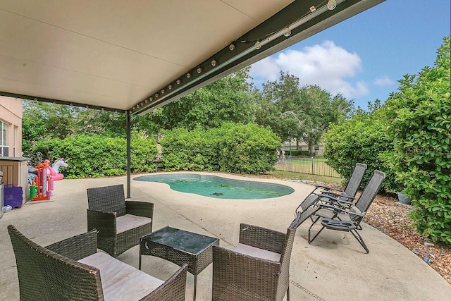 view of swimming pool with a patio, a fenced backyard, and a fenced in pool