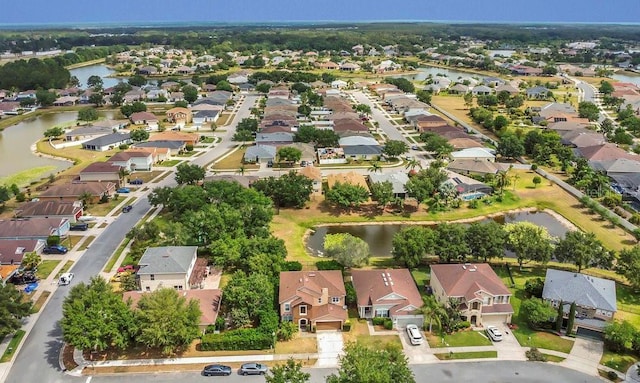 aerial view featuring a residential view and a water view