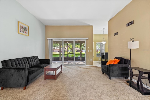 living room with carpet flooring and baseboards