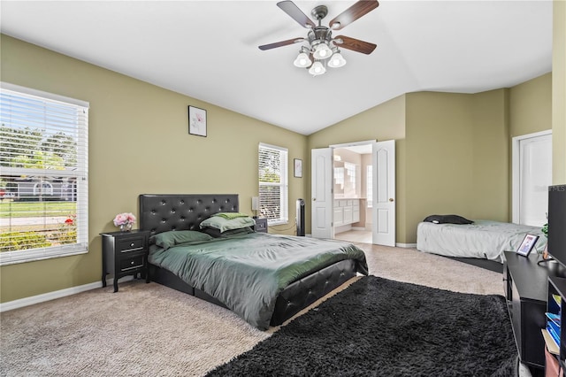 carpeted bedroom with multiple windows, lofted ceiling, and baseboards