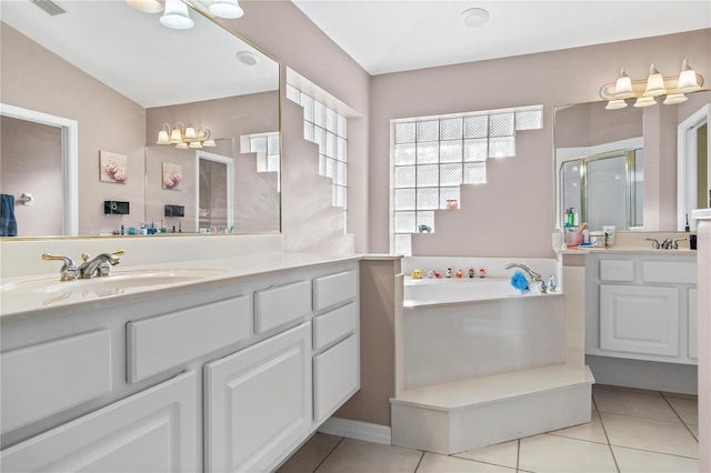 full bathroom with tile patterned floors, a stall shower, two vanities, and a bath