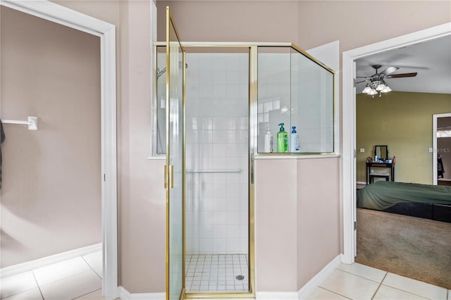 full bath with connected bathroom, tile patterned flooring, baseboards, a stall shower, and a ceiling fan