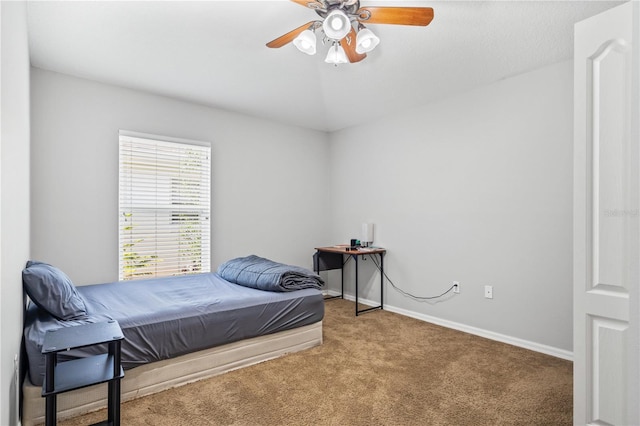 bedroom featuring a ceiling fan, carpet flooring, and baseboards