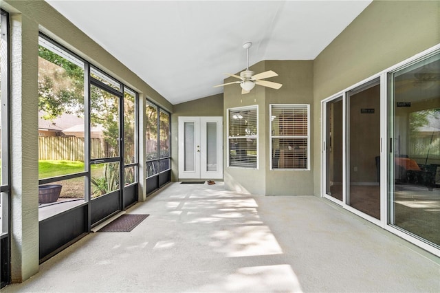unfurnished sunroom with ceiling fan and french doors