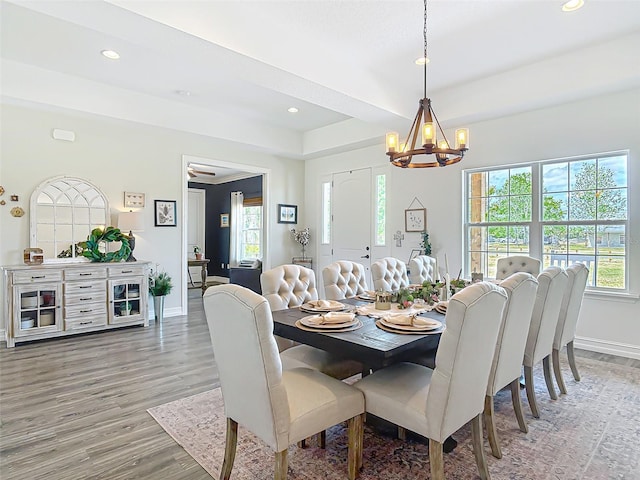 dining area featuring baseboards, recessed lighting, a notable chandelier, and light wood-style flooring