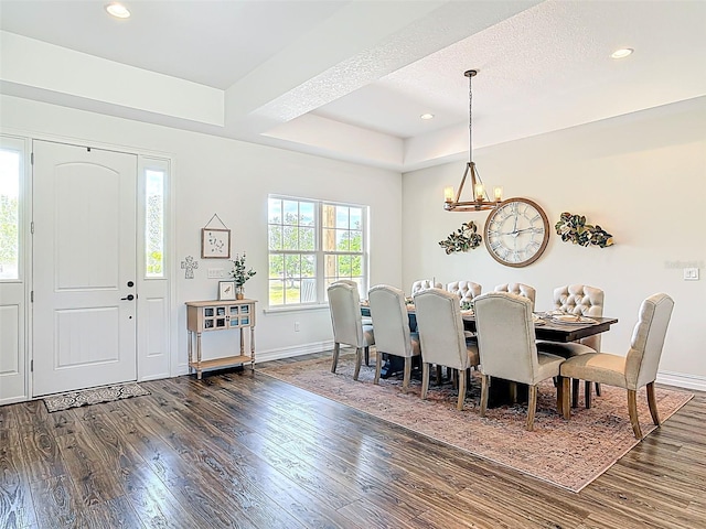 dining area featuring recessed lighting, a notable chandelier, dark wood-style floors, and baseboards