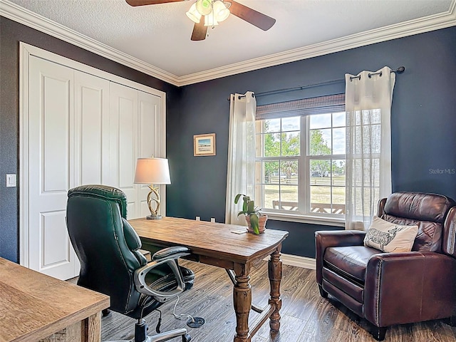home office with baseboards, wood finished floors, a ceiling fan, and ornamental molding