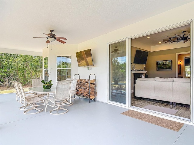 view of patio / terrace with outdoor dining area and ceiling fan