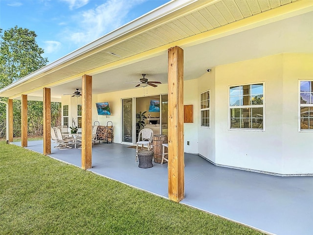 view of patio featuring ceiling fan