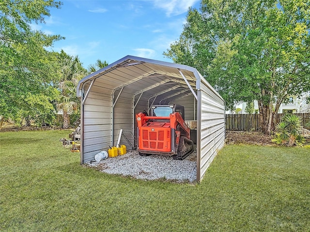 view of outdoor structure featuring a detached carport and fence