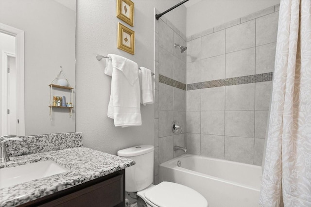 bathroom featuring shower / tub combo with curtain, vanity, and toilet