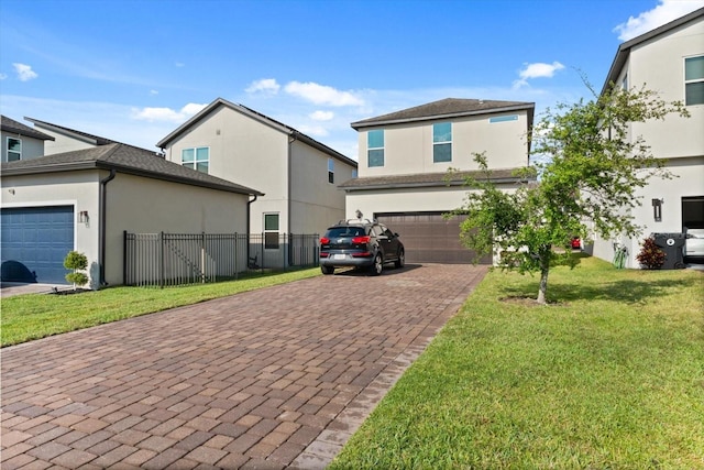 view of front of property with decorative driveway, stucco siding, and an attached garage