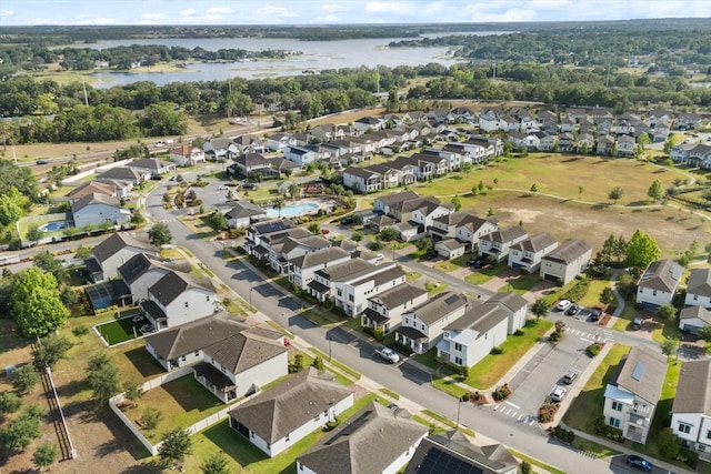 aerial overview of property's location with nearby suburban area and a nearby body of water