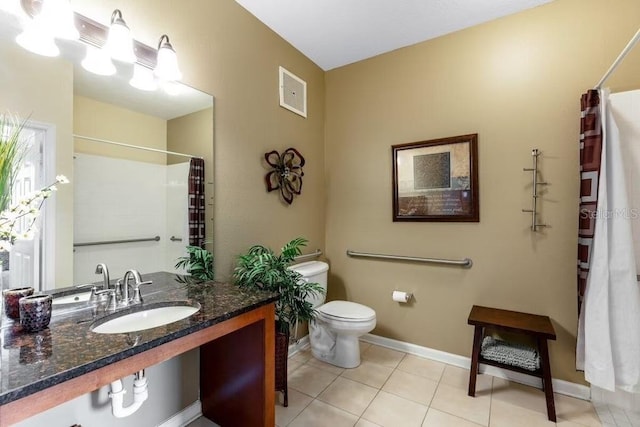 2302 Butterfly Palm Way Unit 105, Kissimmee, FL 34747 - full bathroom with tile patterned floors, toilet, curtained shower, baseboards, and visible vents