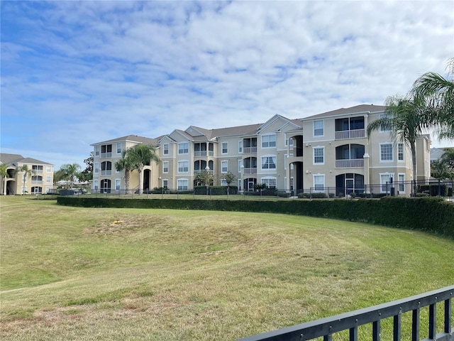 2302 Butterfly Palm Way Unit 105, Kissimmee, FL 34747 - view of building exterior featuring fence