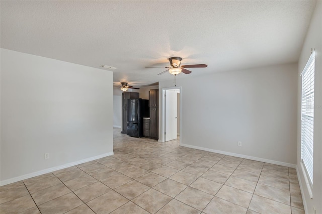 1051 Arden St, Longwood, FL 32750 - spare room featuring baseboards, a ceiling fan, a textured ceiling, and light tile patterned floors