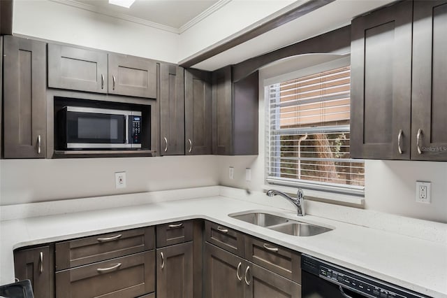 1051 Arden St, Longwood, FL 32750 - kitchen featuring black dishwasher, stainless steel microwave, dark brown cabinetry, and a sink