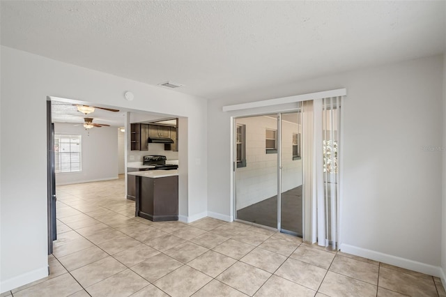 1051 Arden St, Longwood, FL 32750 - unfurnished room featuring ceiling fan, light tile patterned flooring, a textured ceiling, and visible vents