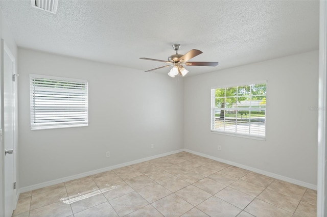 1051 Arden St, Longwood, FL 32750 - unfurnished room with a textured ceiling, ceiling fan, visible vents, and light tile patterned flooring