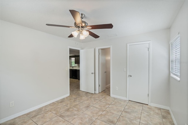 1051 Arden St, Longwood, FL 32750 - unfurnished bedroom with baseboards, ceiling fan, and light tile patterned floors