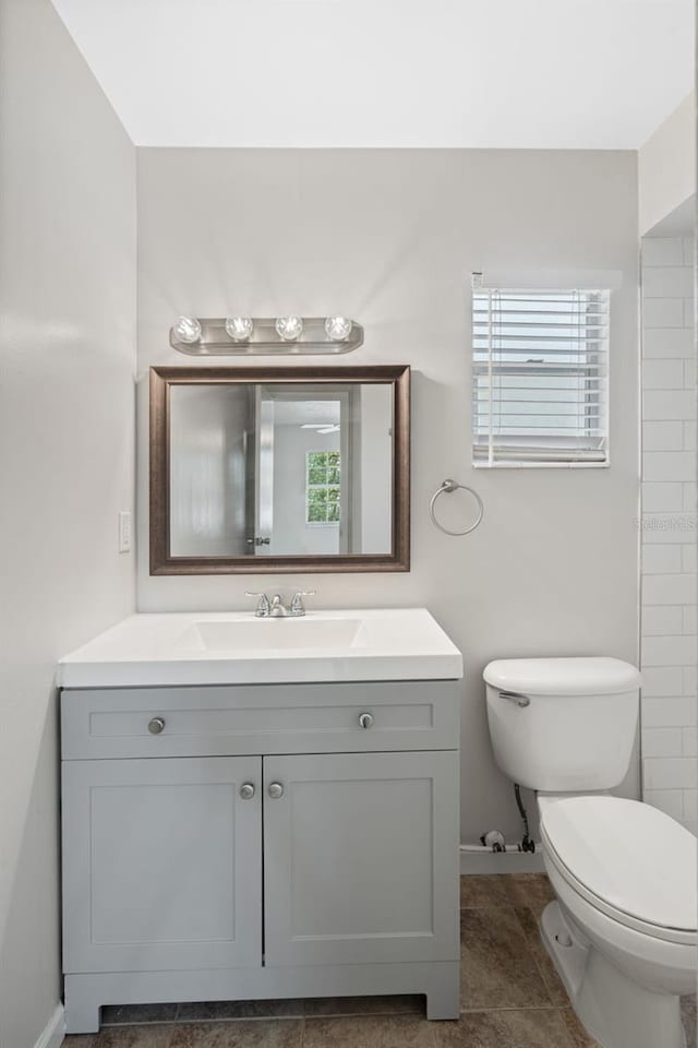 1051 Arden St, Longwood, FL 32750 - bathroom with baseboards, vanity, and toilet