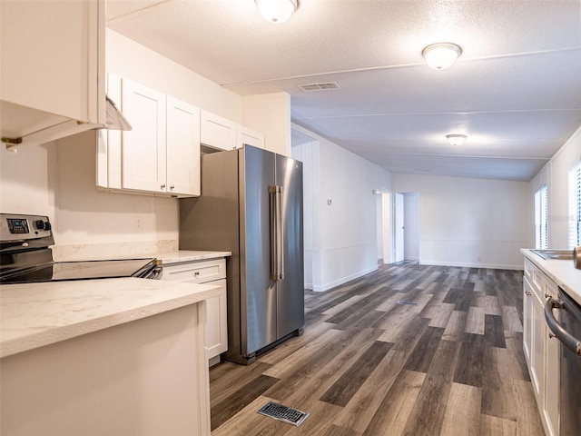 kitchen with dark wood-style floors, visible vents, stainless steel appliances, and white cabinets