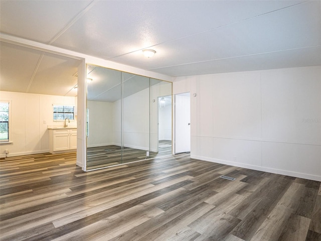 interior space featuring wood finished floors and a sink