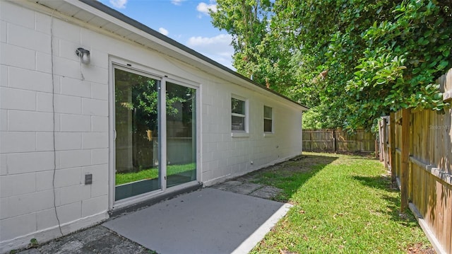 view of yard featuring a patio and a fenced backyard