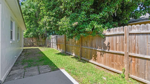 view of yard with a fenced backyard