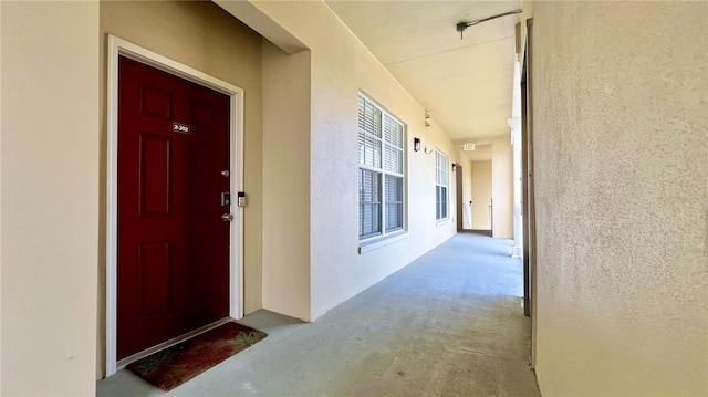 doorway to property with stucco siding
