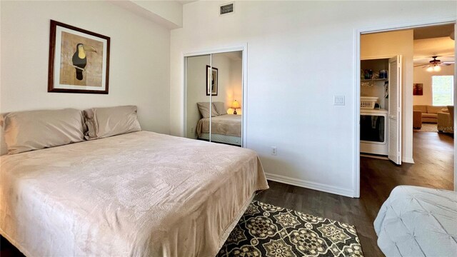 bedroom with baseboards, visible vents, and dark wood finished floors