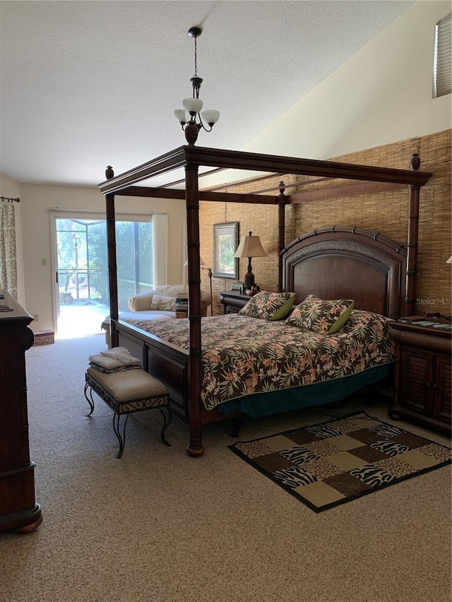 bedroom featuring access to outside, a fireplace, and carpet flooring