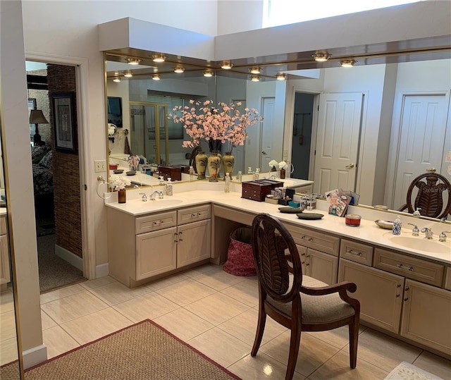 full bath with tile patterned floors, a stall shower, and vanity