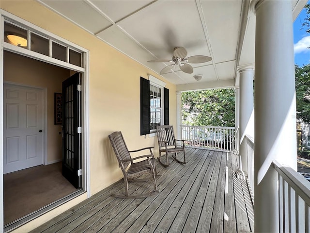 deck featuring a porch and a ceiling fan